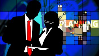 Silhouette of man and woman working together