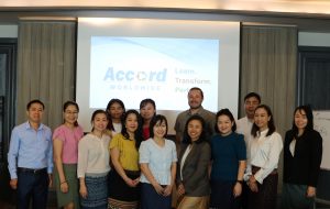 group of participants and trainer in Laos training offered by Accordemy